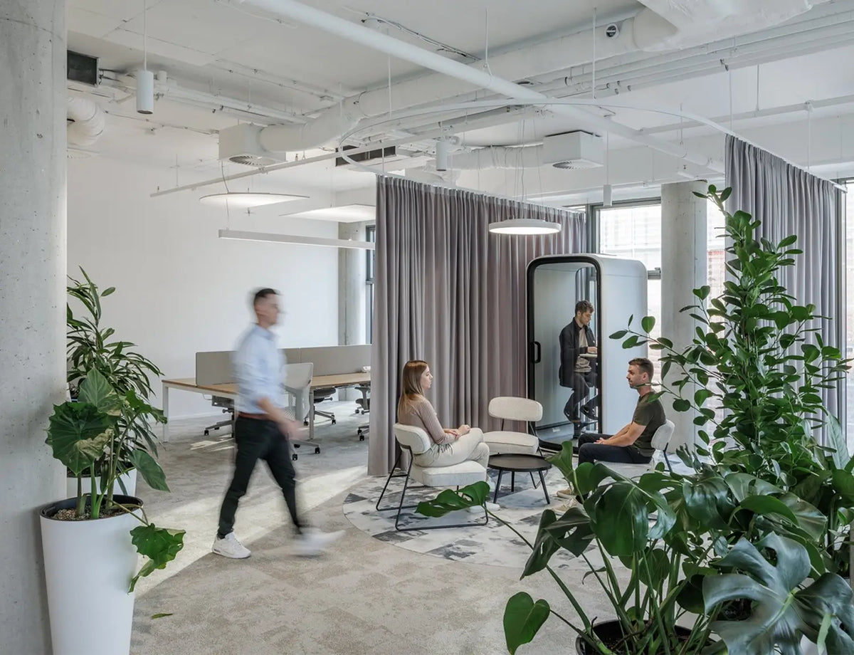 Open workplace with a Framery One pod