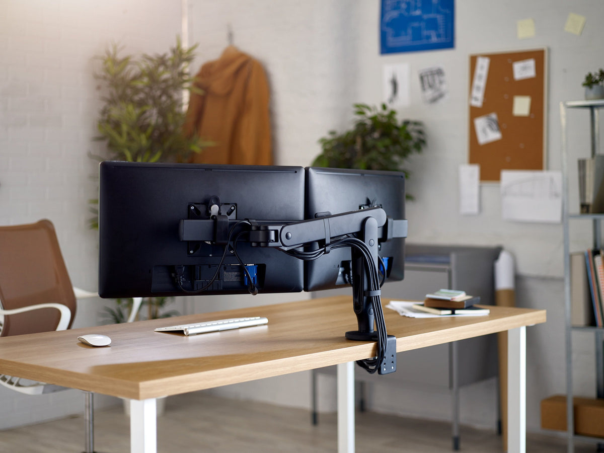 cbs-ollin-dual-monitor-arm in a styled interior