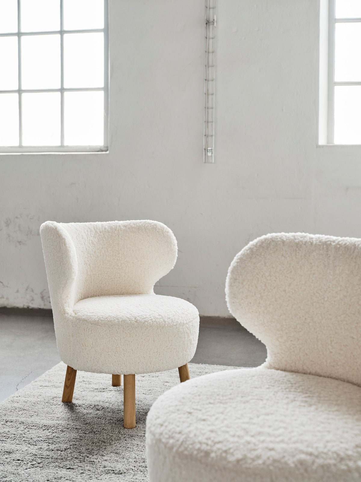 Cute easy chairs in a styled interior