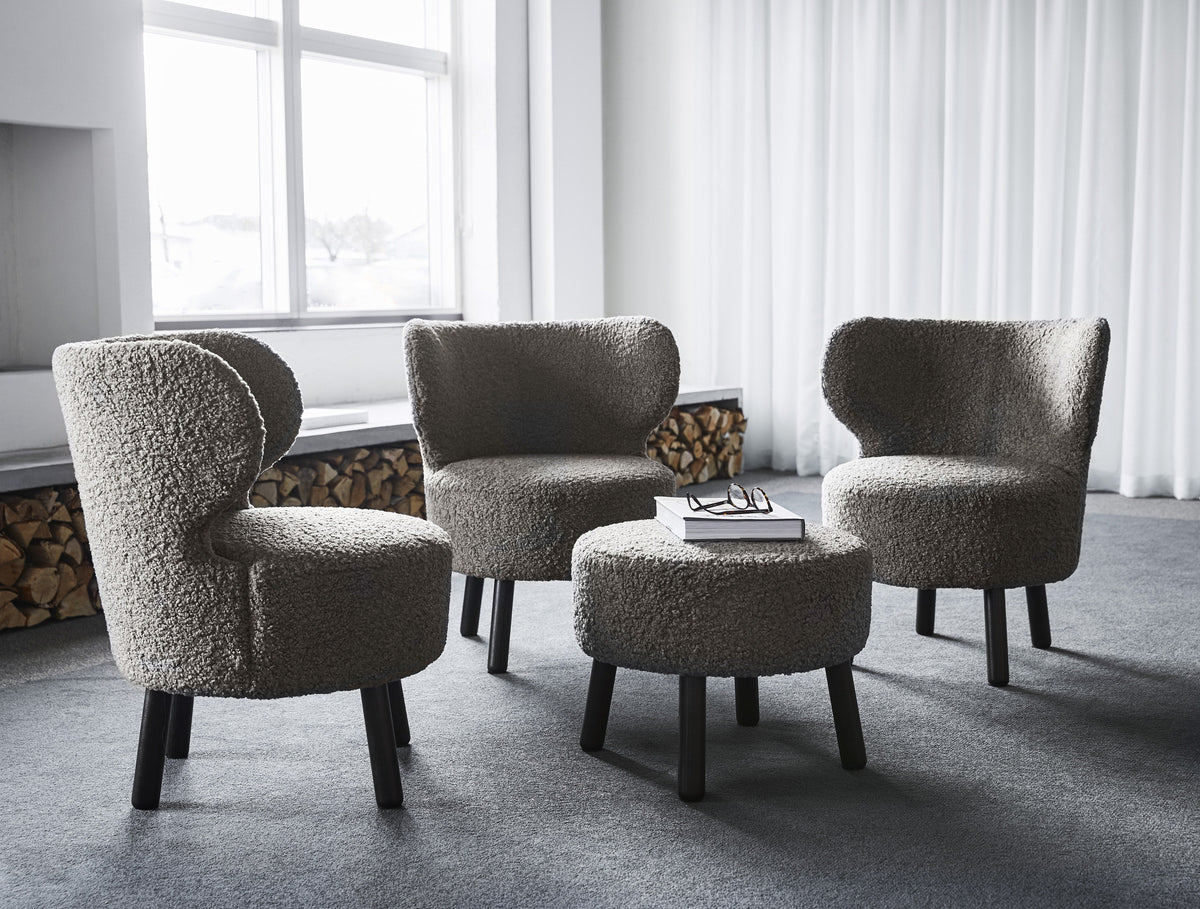 Cute chairs and pouf in a styled interior