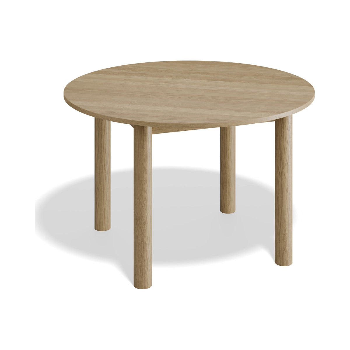 Nordica 1200 mm round dining table in natural oak, three-quarter view