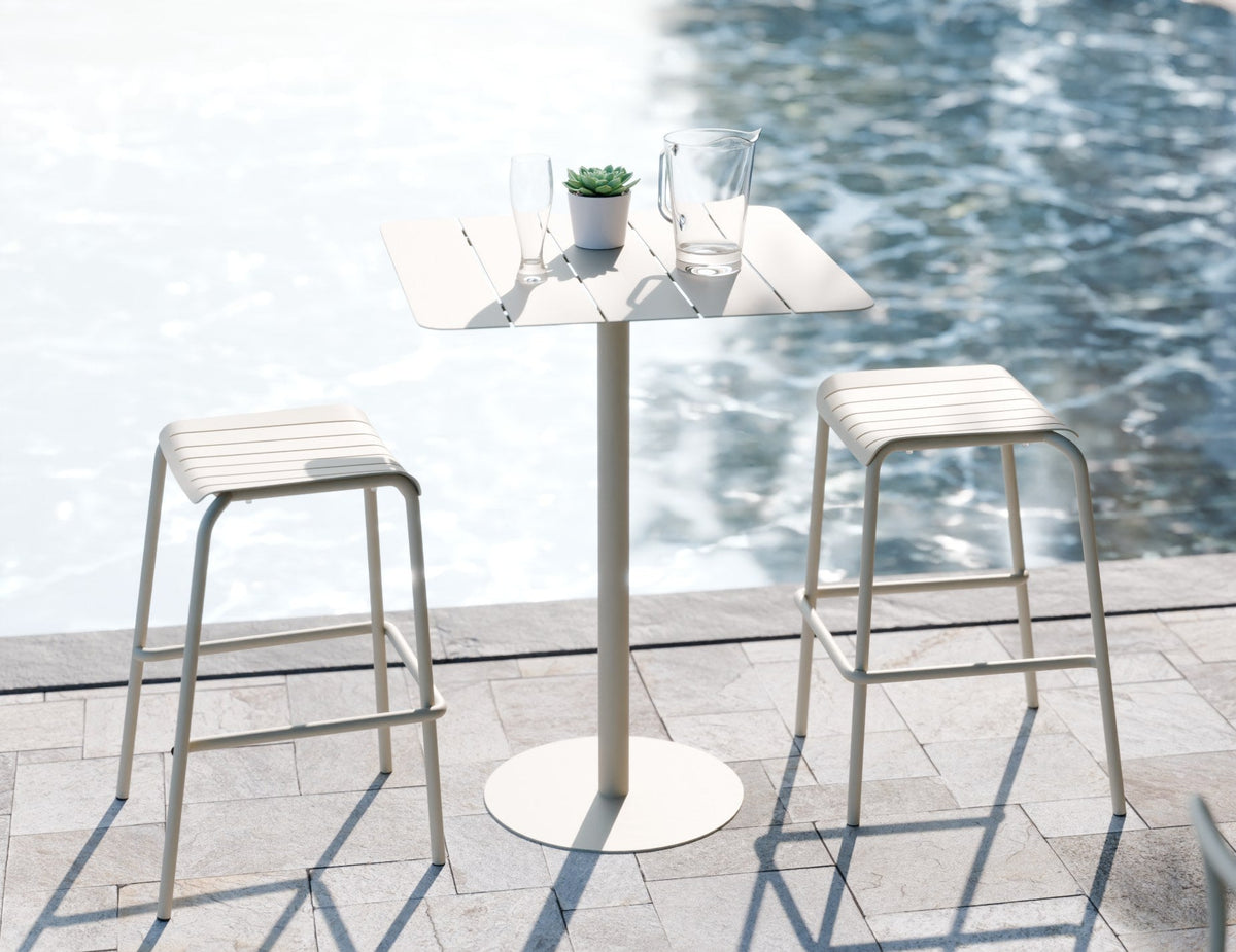 Roku Outdoor Backless Bar Stool in a styled interior