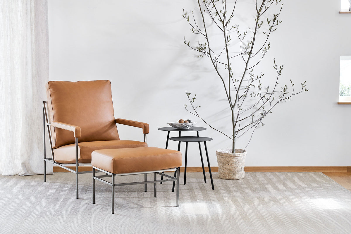 Sputnik side table beside a Seventy easy chair