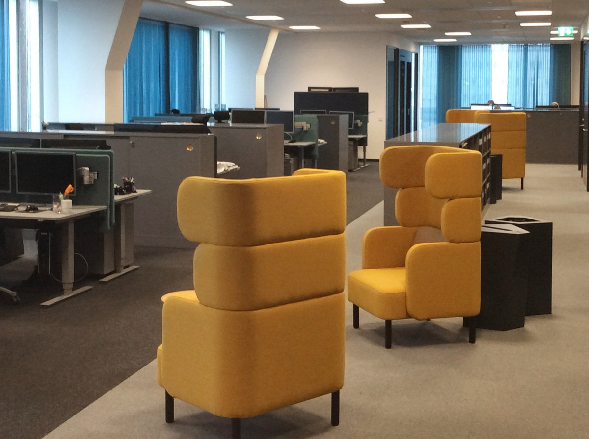 Story high-backed seating in a styled interior