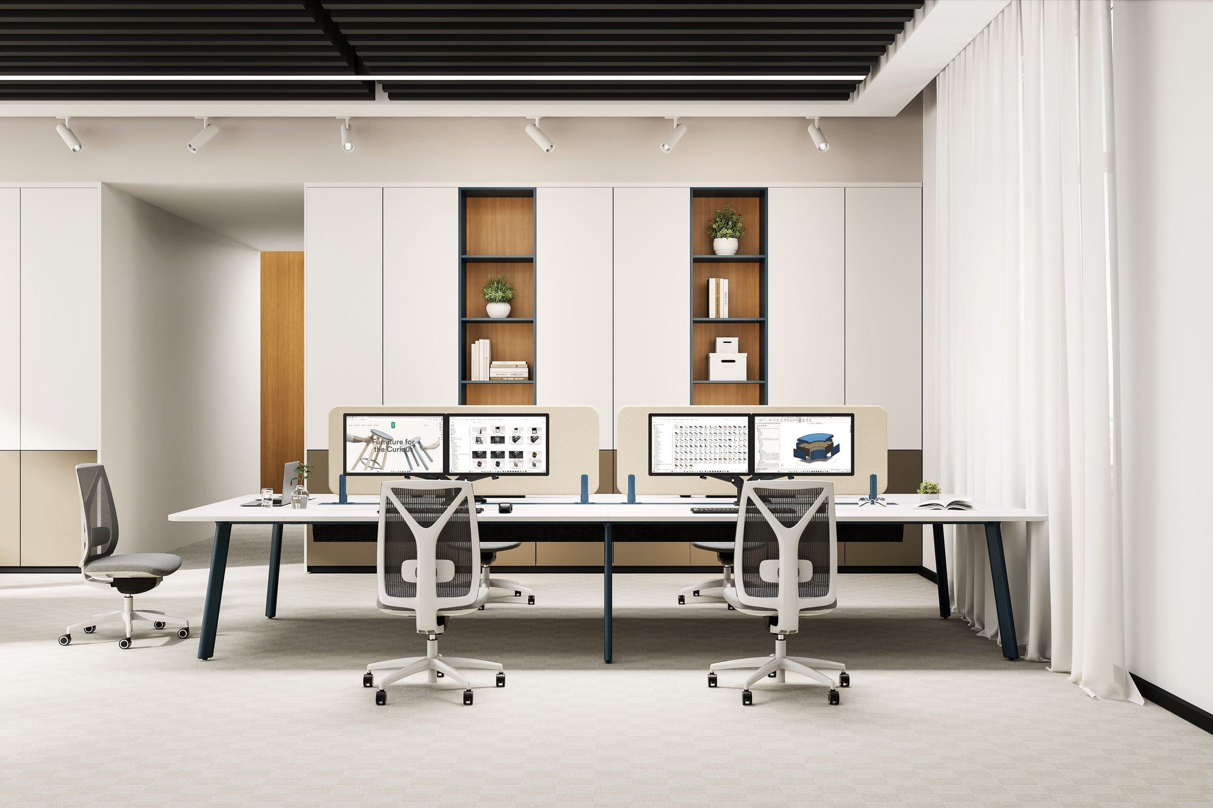 Six person Rosie workstation run with white worktops, dark blue angled legs, pale acoustic screens and four monitors, in a light office with joinery behind