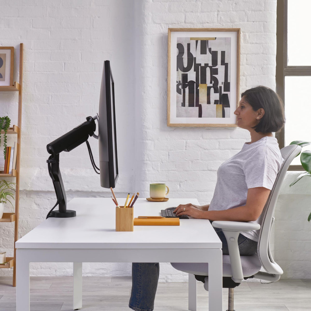 cbs-flo-x-monitor-arm in a styled interior