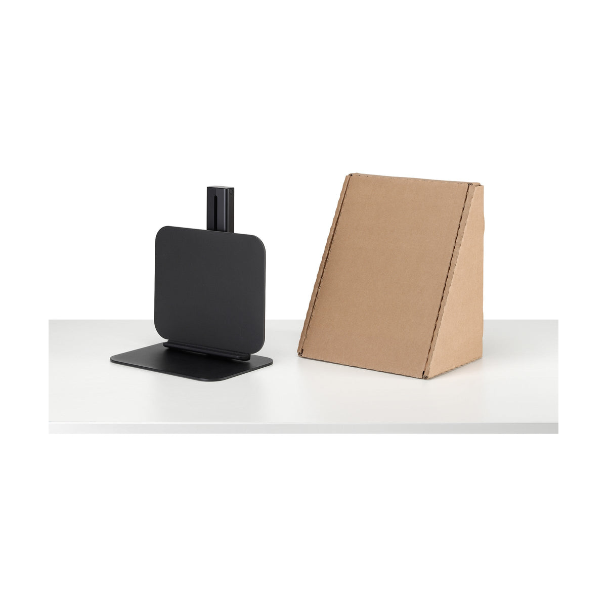 Lana Laptop Stand folded, with its plastic free packaging