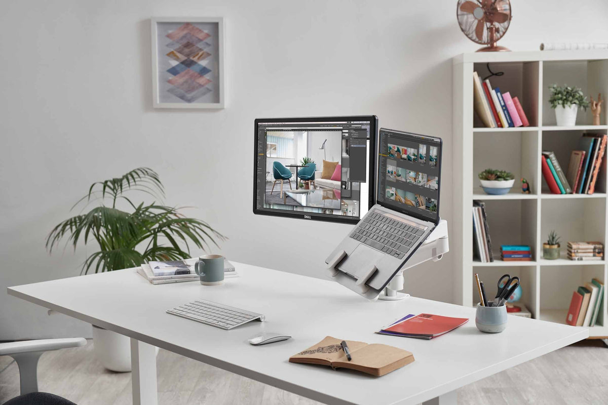 cbs-lima-monitor-arm-with-laptop-mount in a styled interior