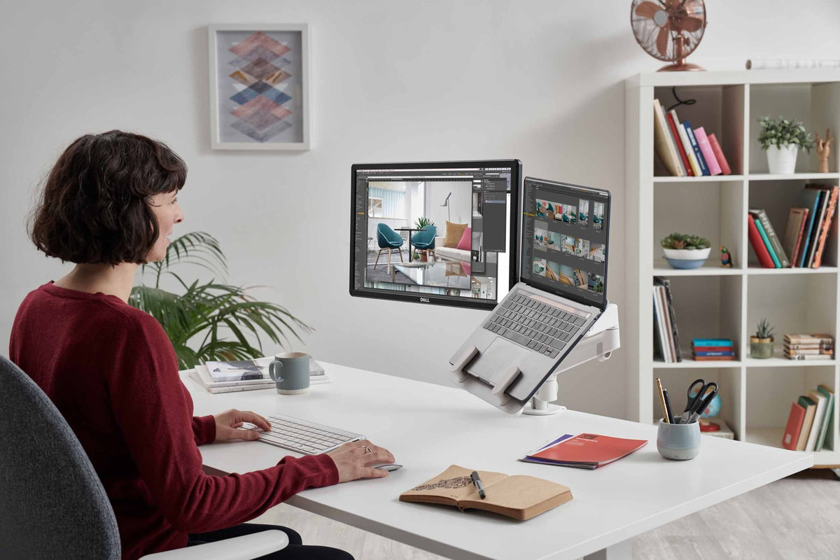 cbs-lima-monitor-arm-with-laptop-mount in a styled interior