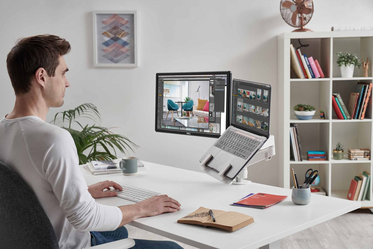 cbs-lima-monitor-arm-with-laptop-mount in a styled interior