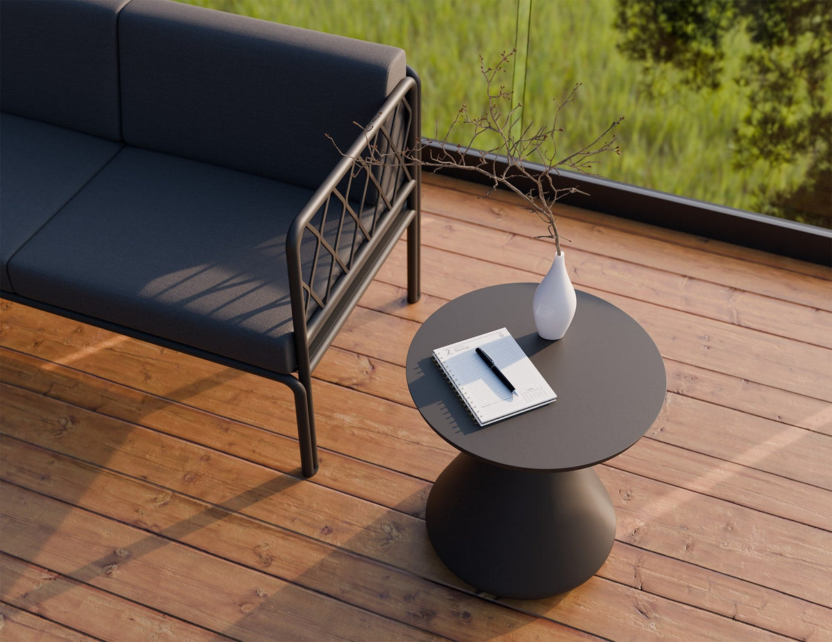 Kora Outdoor Side Table in a styled interior