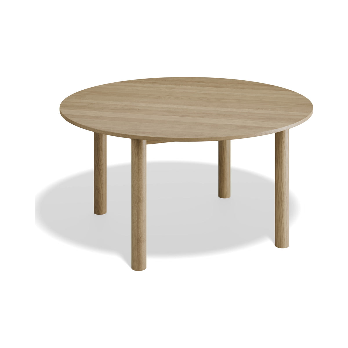 Nordica 1500 mm round dining table in natural oak, three-quarter view