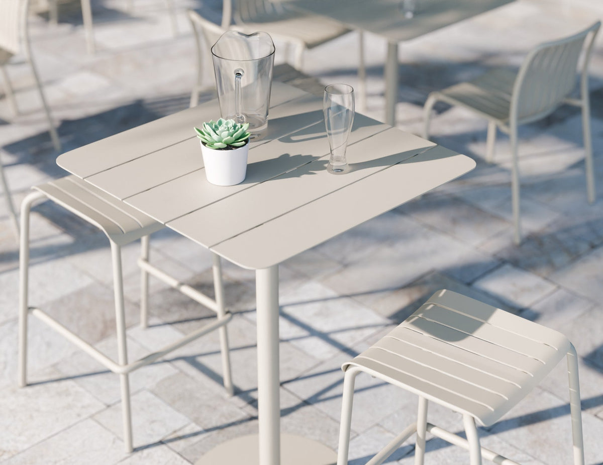 Roku Outdoor Backless Bar Stool in a styled interior