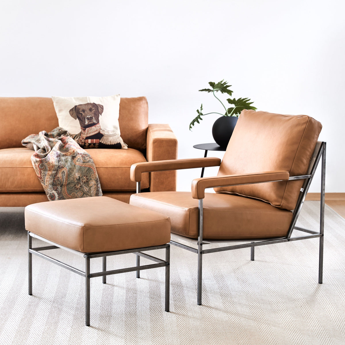 Sputnik side table beside a Seventy easy chair