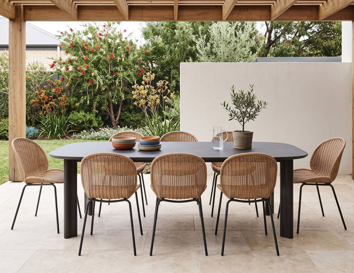 Vela Outdoor Dining Table in a styled interior
